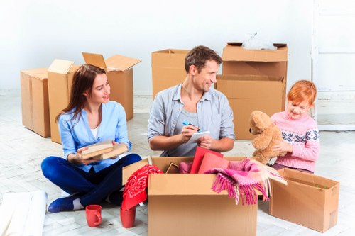 Local movers handling furniture near Manor House streets
