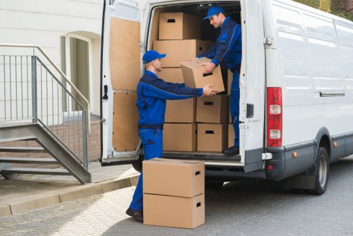 Professional movers loading commercial items in Manor House