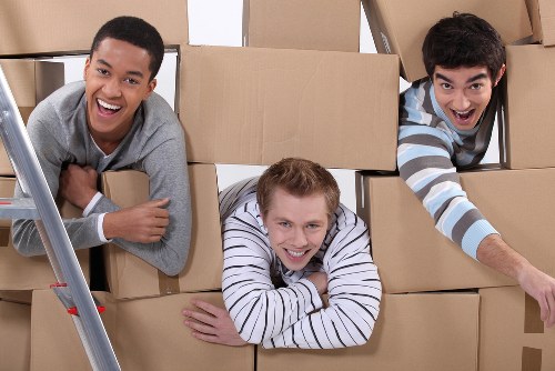 Careful unloading of moving boxes and furniture at a Manor House property