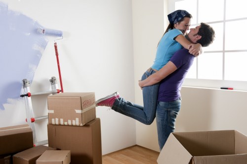 Professional packer organising household boxes in a Manor House flat