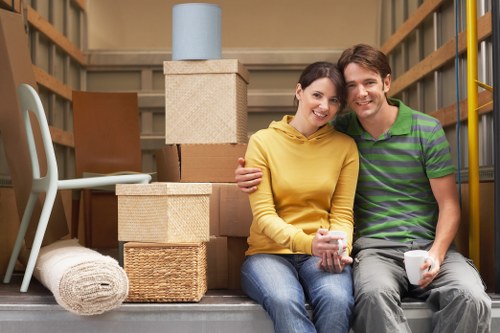Professional movers handling furniture in a Manor House property