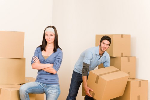 Professional office movers handling furniture and equipment during a Manor House relocation