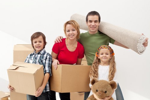 Local removals team transporting office furniture in North London