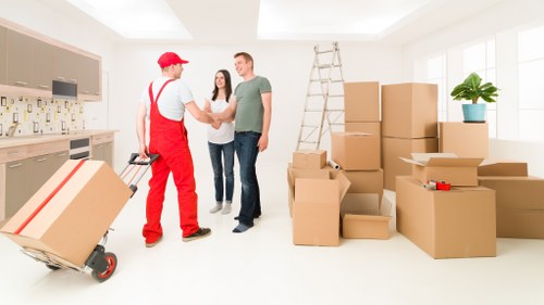Packed boxes and furniture ready for a local house move in Manor House