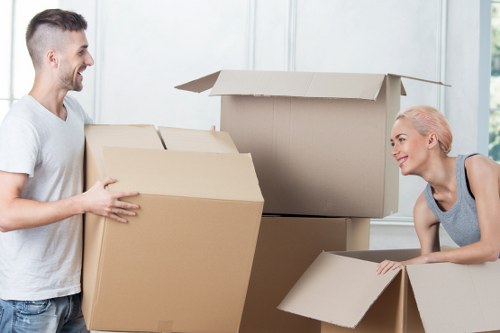Professional movers loading household items for a local Manor House relocation