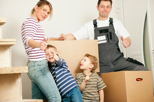Flat move in Manor House with stairs, narrow access, and packed boxes